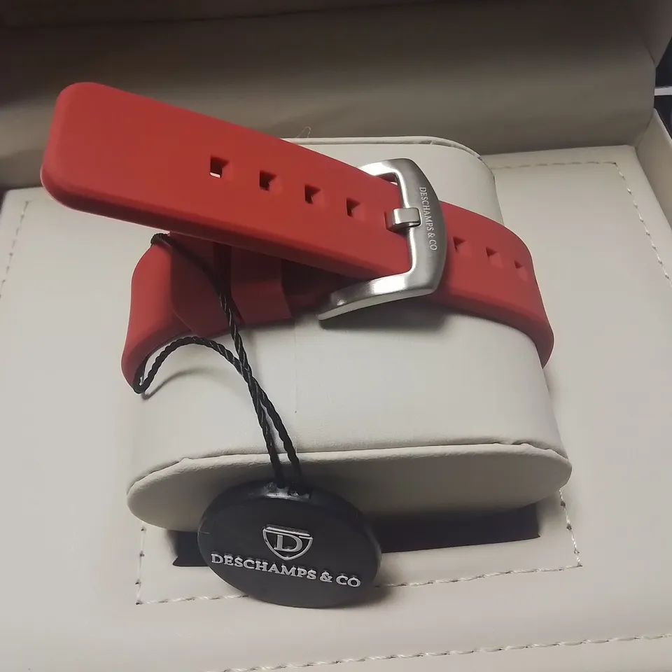 DESCHAMPS & CO STAINLESS STEEL SKELETON DIAL GENTS WATCH WITH AUTOMATIC MOVEMENT AND RED RUBBER STRAP IN WOODEN GIFT BOX