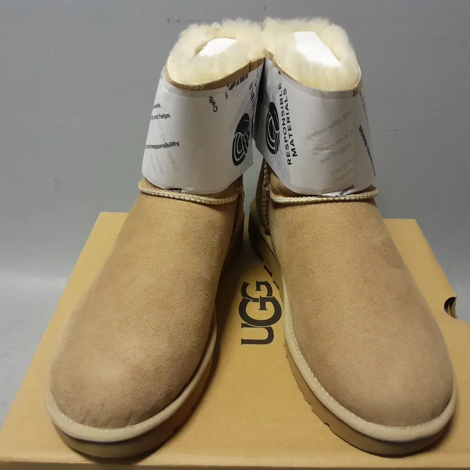 BOXED PAIR OF UGGS MINI BAILEY BOW II IN SAND - UK 7