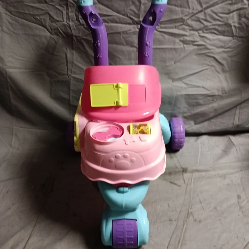 TODDLER PUSH-ALONG WALKER TOY – PINK BODY WITH BLUE WHEELS AND PURPLE HANDLE