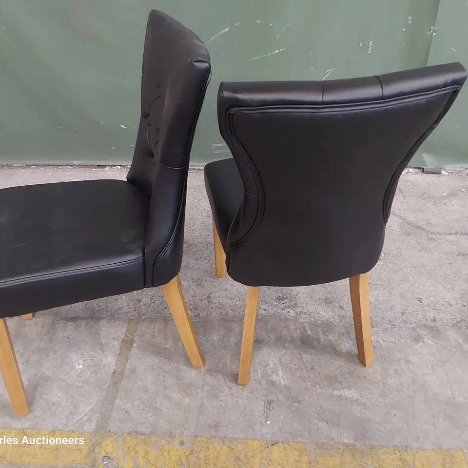 PAIR OF UPHOLSTERED BUTTONED BACK DINING CHAIRS BLACK PU ON NATURAL WOOD LEGS 