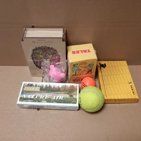APPROXIMATELY 12 ASSORTED TOYS & GAMES PRODUCTS TO INCLUDE MAGIC PUZZLES MIGHTY LION, TALES FAMILY EDITION, TENNIS BALL, ETC