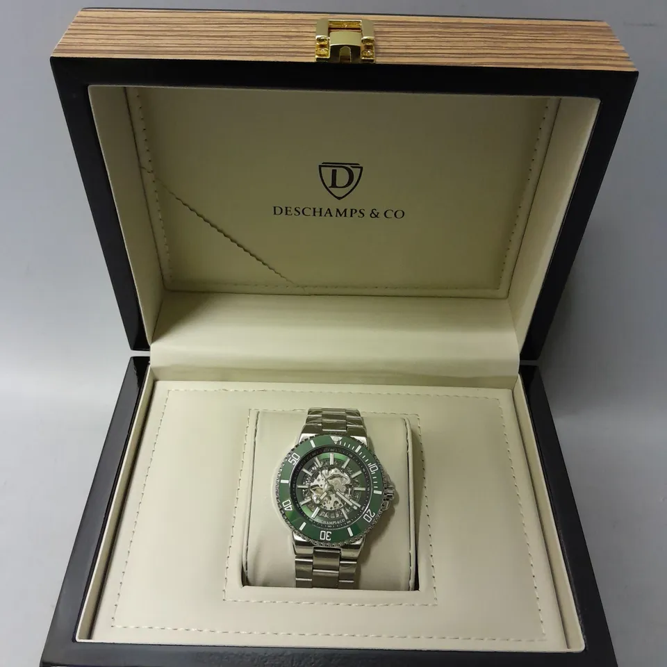 BOXED DESCHAMPS & CO AUTOMATIC GREEN SKELETON DIAL WATCH