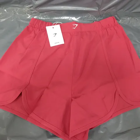 GYMSHARK SCALLOP HEM SHAPED SHORTS IN PINK - MEDIUM