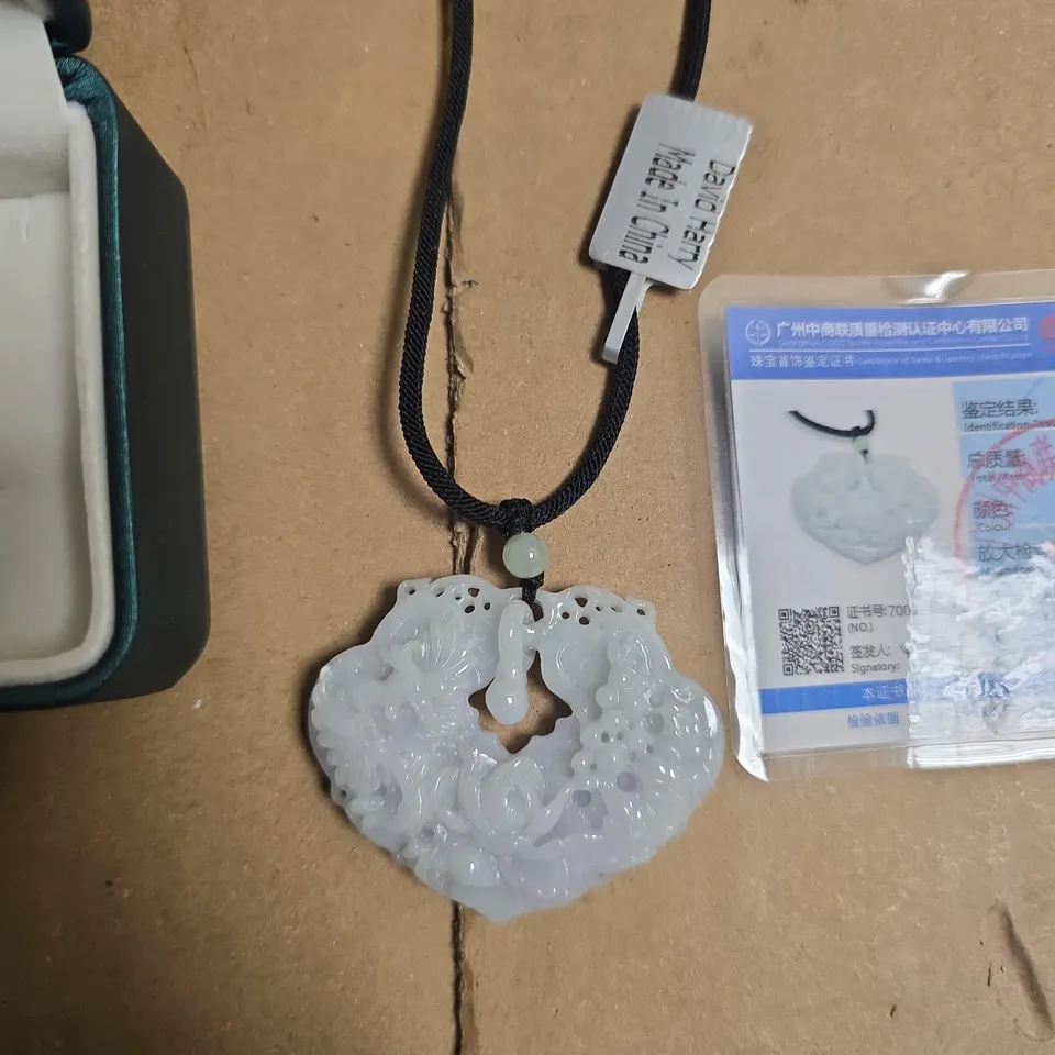 JADEITE JADE PENDANT NECKLACE ON BLACK CORD – GREEN/LAVENDER JADE, 36.6 G, WITH CERTIFICATE