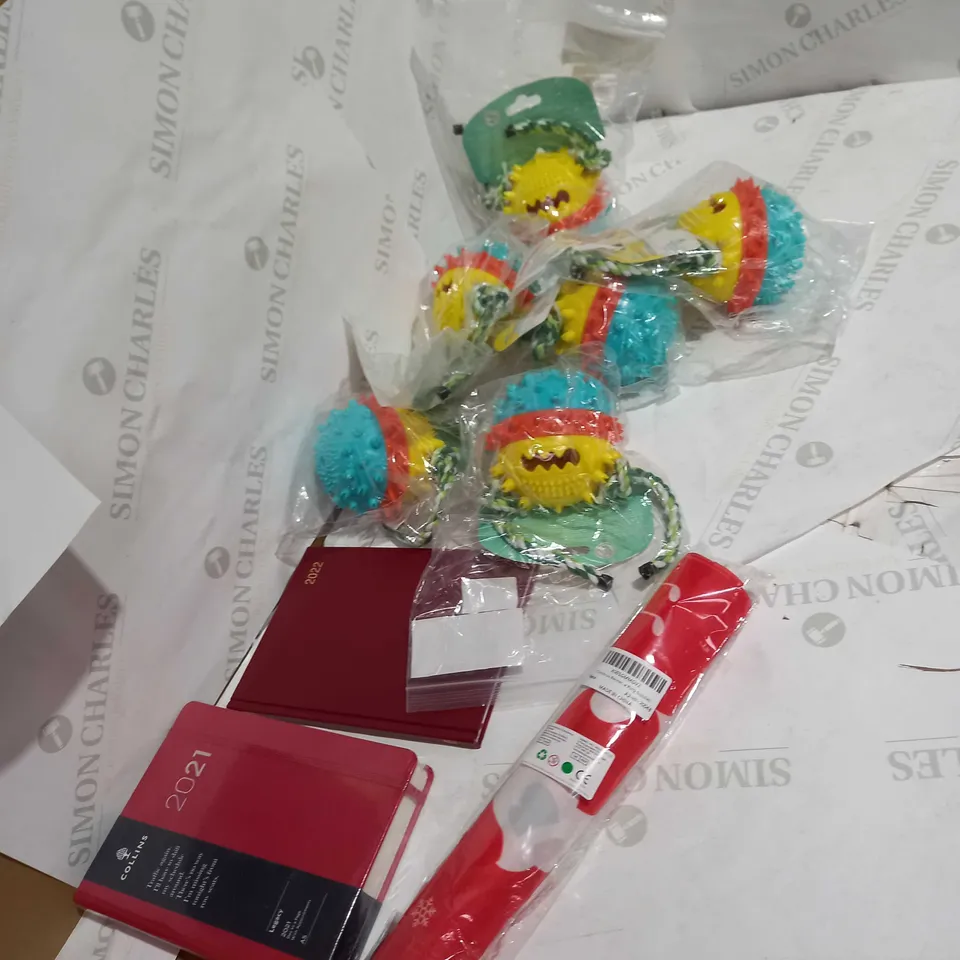 LOT OF APPROX 10 ITEMS TOO INCLUDE CALENDARS DOG TOYS AND PARTY ITEMS 