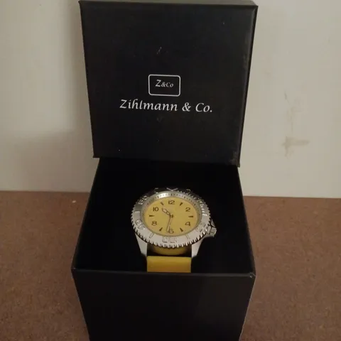 ZIHLMANN & CO STAINLESS STEEL WATCH WITH YELLOW FACE & YELLOW RUBBER STRAP