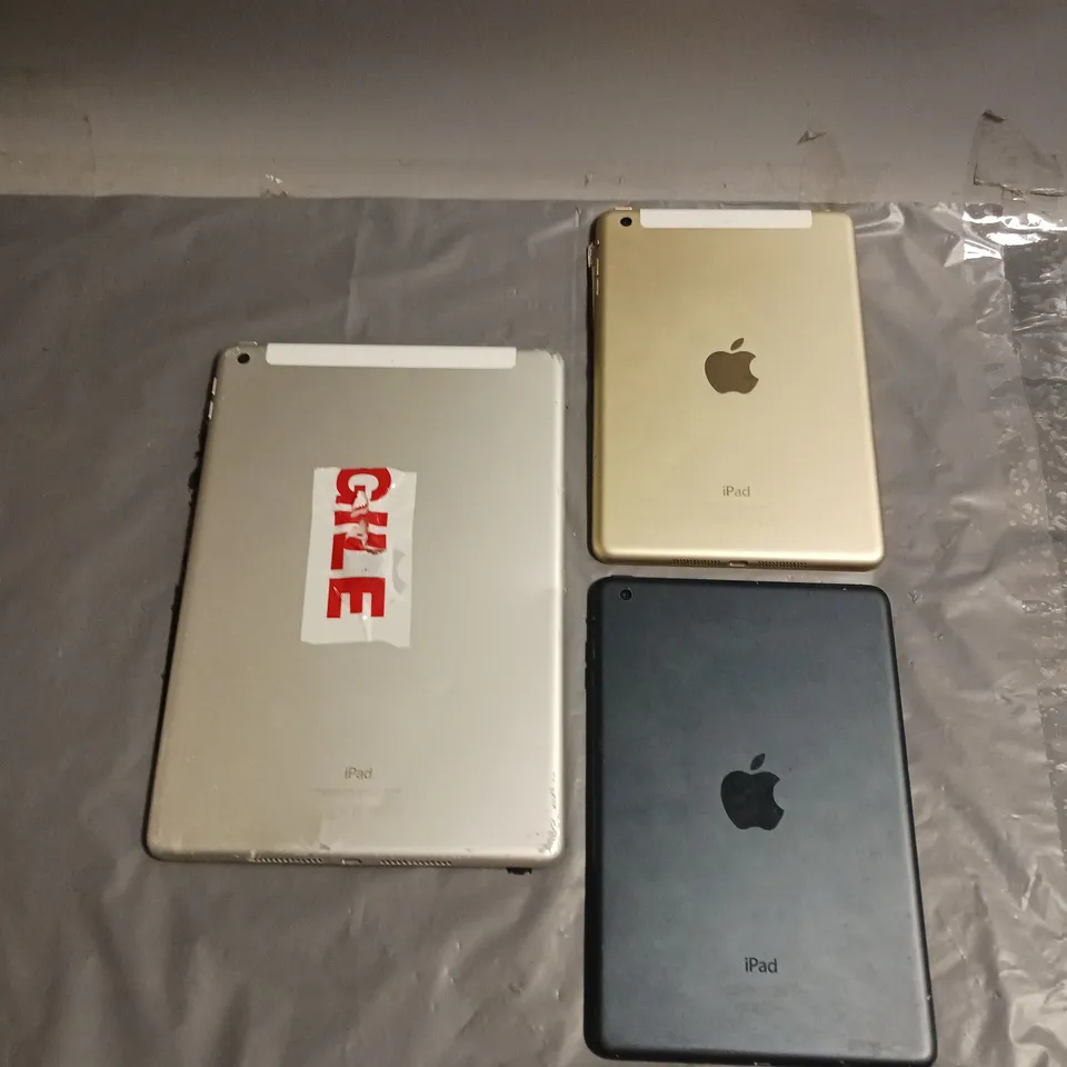 APPLE LOT OF 3 HEAVILY DAMAGED TABLETS TO INCLUDE IPAD MINI 1ST GEN, IPAD MINI 3RD GEN AND IPAD 9TH GEN