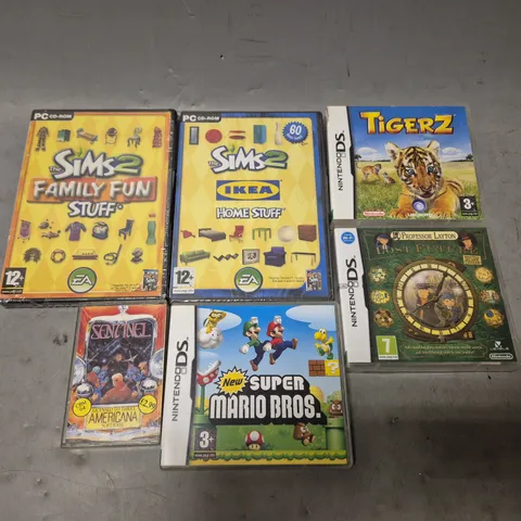 TOTE OF APPROXIMATELY 15 ASSORTED VIDEO GAMES TO INCLUDE - PC THE SIMS 2 IKEA HOME STUFF , NINTENDO DS TIGER Z , KICK OFF ETC