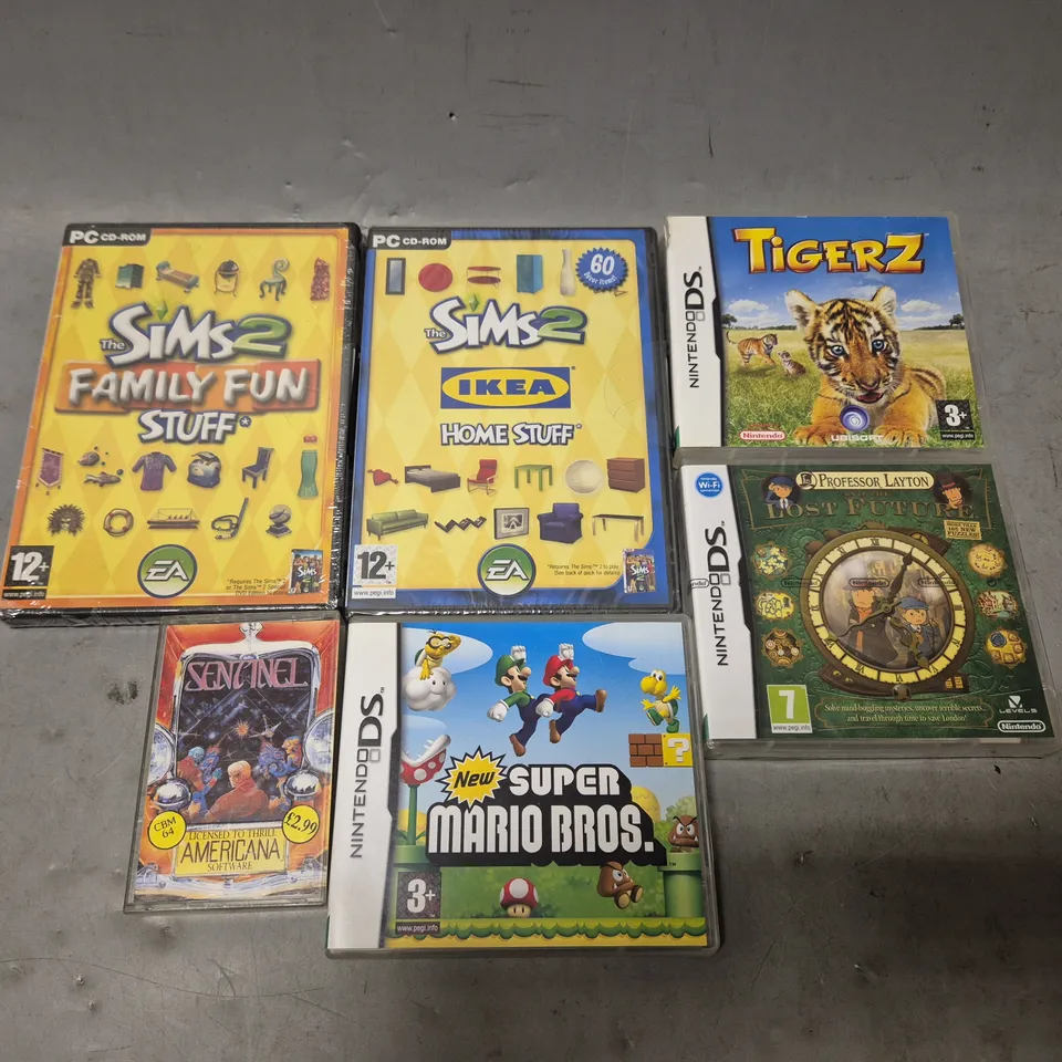 TOTE OF APPROXIMATELY 15 ASSORTED VIDEO GAMES TO INCLUDE - PC THE SIMS 2 IKEA HOME STUFF , NINTENDO DS TIGER Z , KICK OFF ETC
