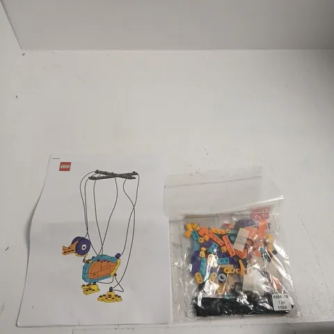 LEGO DUCK MARIONETTE SET WITH INSTRUCTION SHEET AND SEALED BRICK BAG