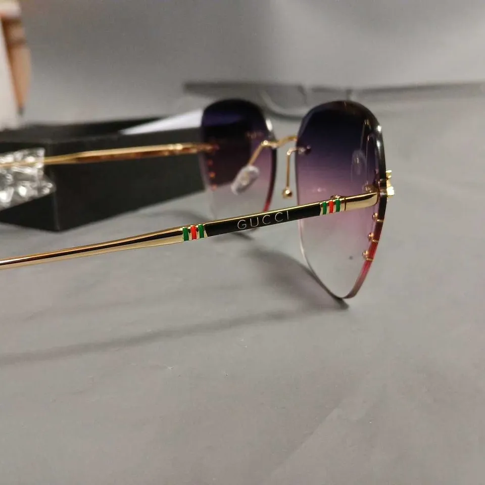 BOXED PAIR OF GUCCI GLASSES