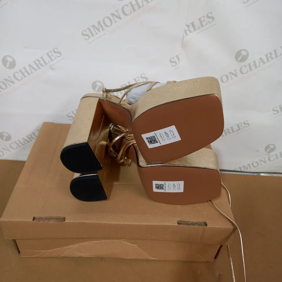 BOXED PAIR OF ASOS GOLD PLATFORM HIGH HEELS SIZE 6