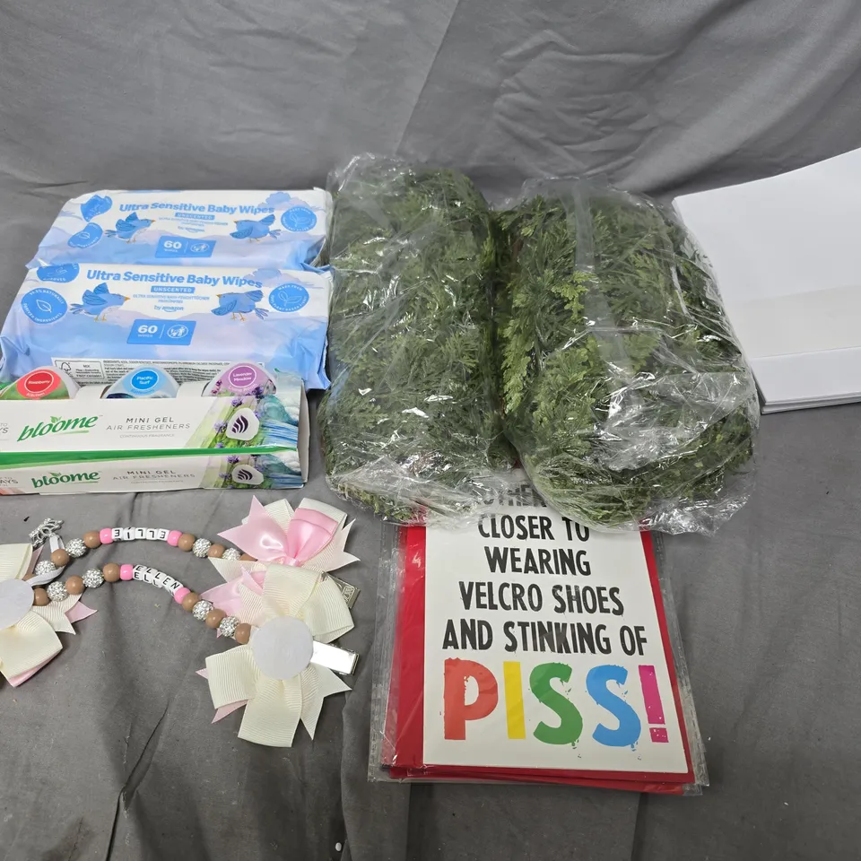 APPROXIMATELY 10 ASSORTED HOUSEHOLD ITEMS TO INCLUDE BABY WIPES, ARTIFICIAL FLOWERS AND CARDS
