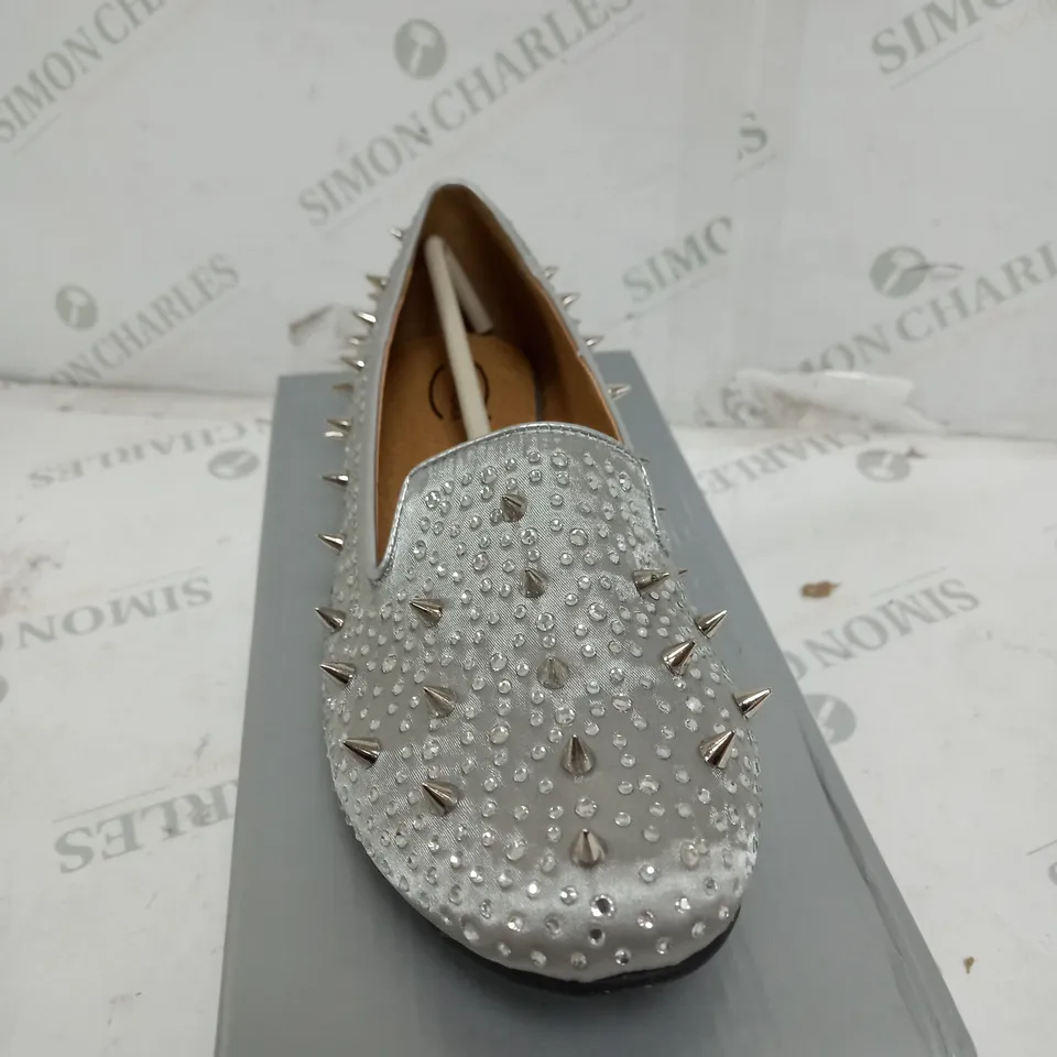 BOX OF APPROXIMATELY 7 CASANDRA FLAT SPIKED SILVER SATIN SHOES 