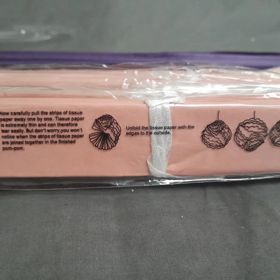 LARGE QUANTITY OF TISSUE PAPER DECORATIONS IN PURPLE AND PINK 