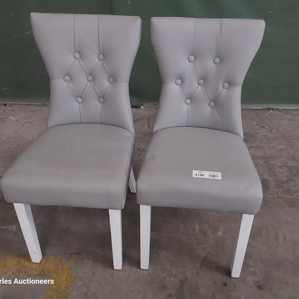 PAIR OF UPHOLSTERED BUTTONED BACK DINING CHAIRS GREY PU ON WHITE PAINTED LEGS 