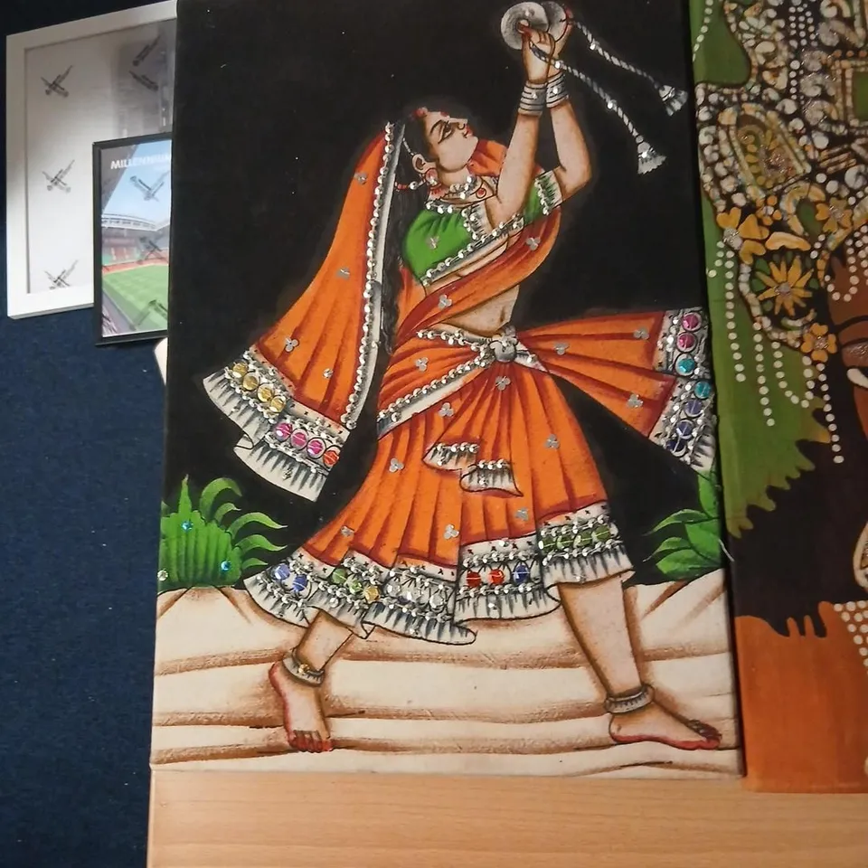 TWO  HANDMADE RAJASTHANI FABRIC STYLE WALL HANGINGS ONE DEPICTING A TRADITIONAL DANCER AND ONE DEPICTING A KERALA LADY