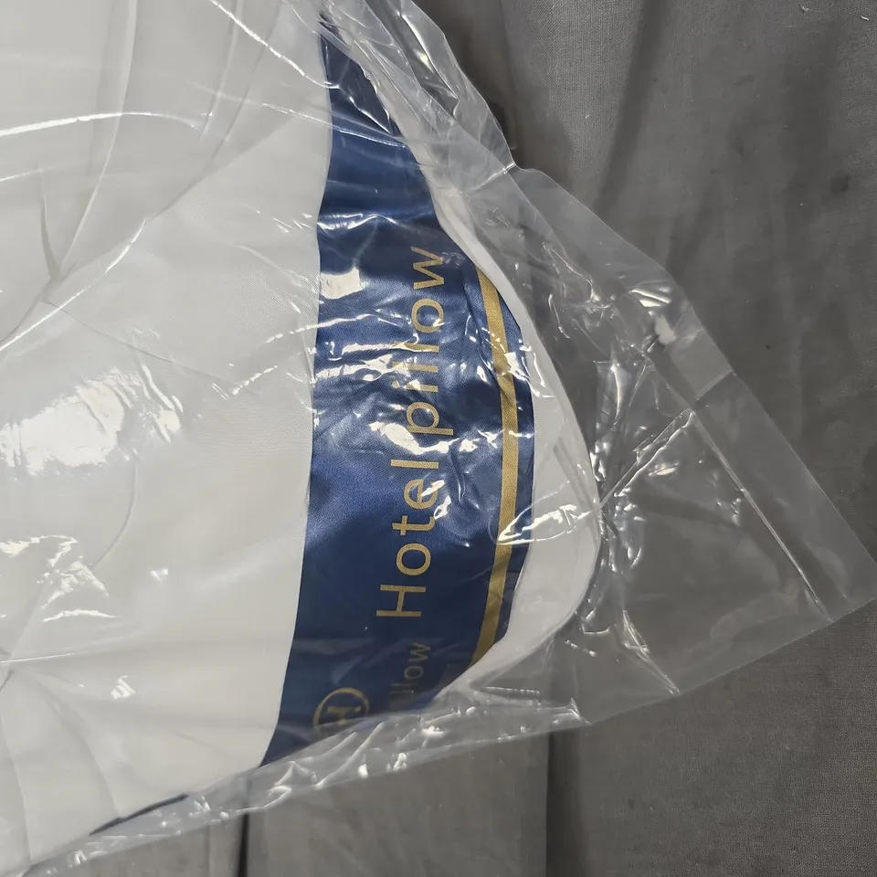 4X WHITE PILLOW IN SEALED PACKAGING WITH BLUE AND GOLD LABEL