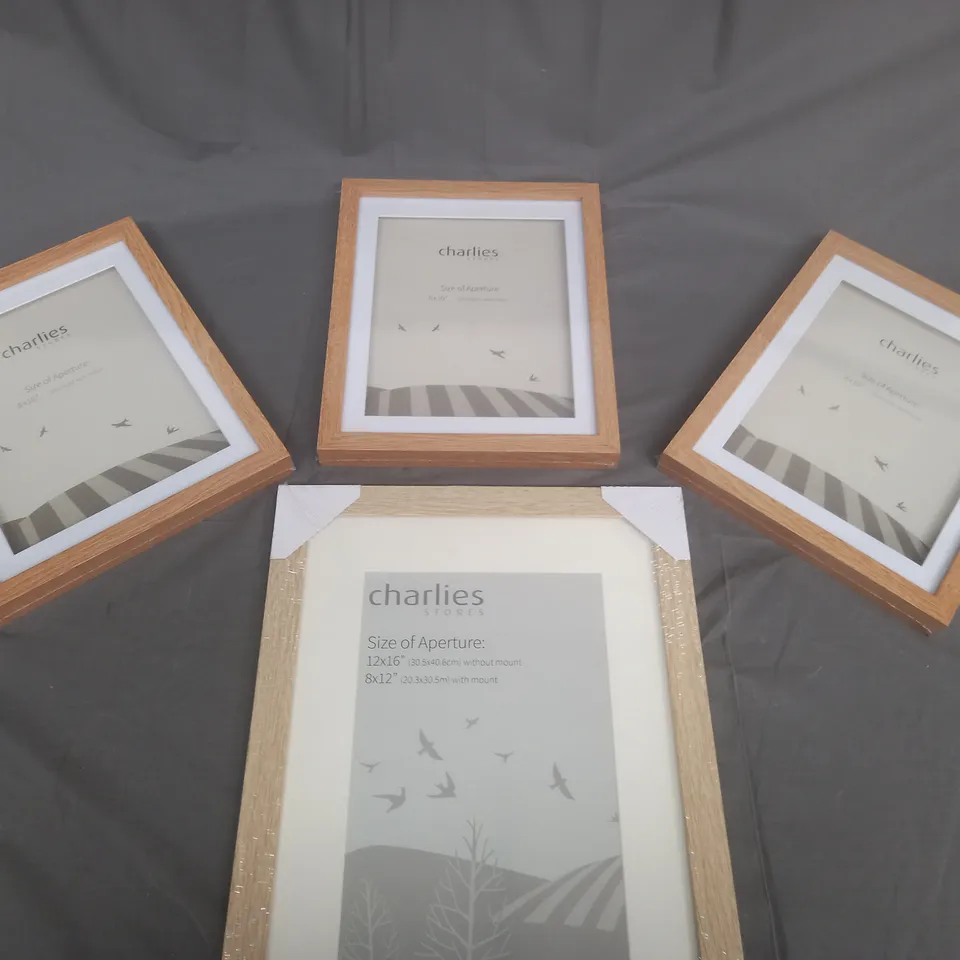 BOXED SET OF 4 CHARLIES STORES  PICTURE FRAMES IN VARIOUS SIZES 