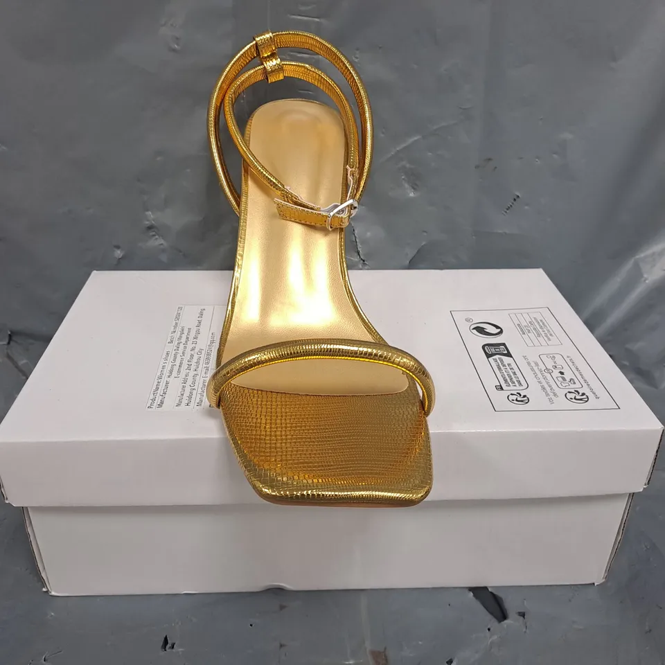 BOXED PAIR OF UNBRANDED OPEN TOE STRAPPY HEELED SANDALS IN METALLIC GOLD SIZE EU 42