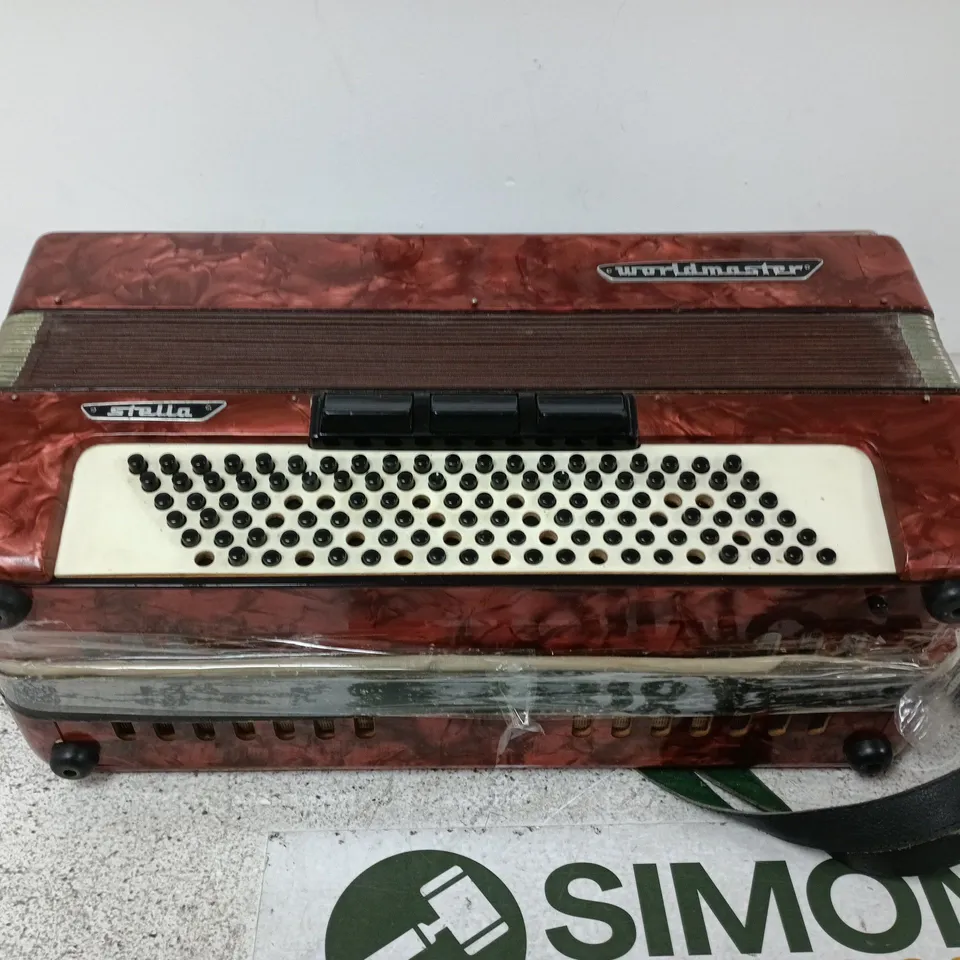 WORLDMASTER STELLA ACCORDION (RED MARBLED CASING) – KEYBOARD & BUTTON MODEL