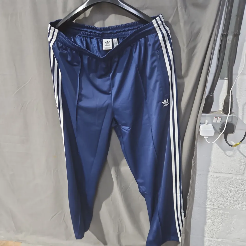 ADIDAS NAVY TRACK PANTS WITH WHITE STRIPES – UK XL 