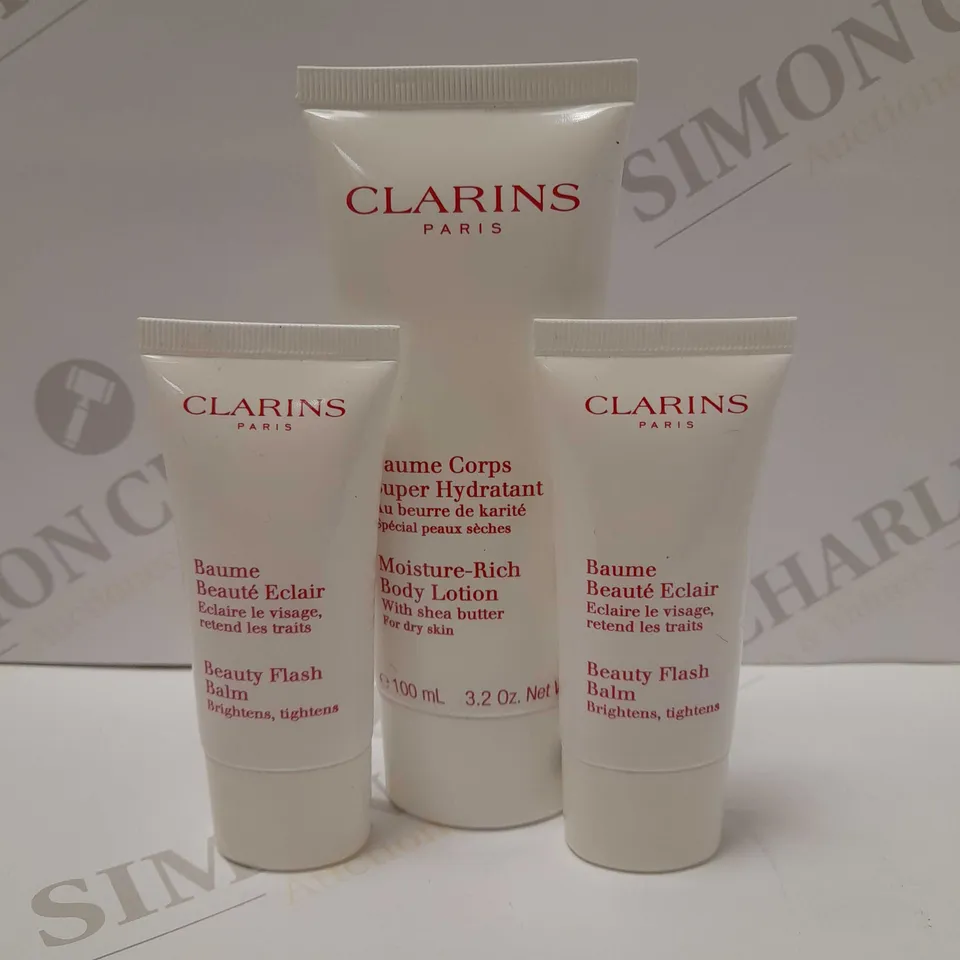 LOT OF 3 ASSORTED CLARINS PRODUCTS TO INCLUDE MOISTURE-RICH BODY LOTION 100ML & 2 X 30ML BEAUTY FLASH BALM
