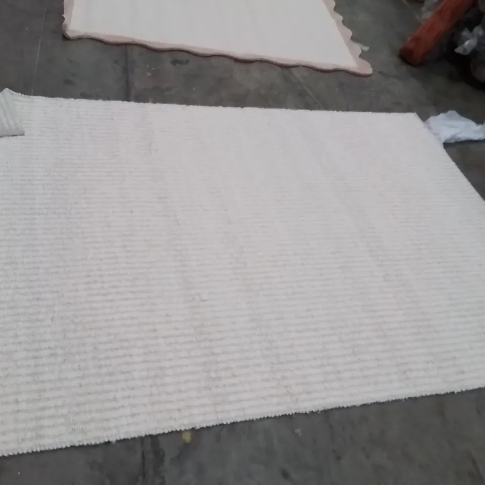 STILLAGE OF APPROXIMATELY 20 QUALITY DESIGNER RUGS XL