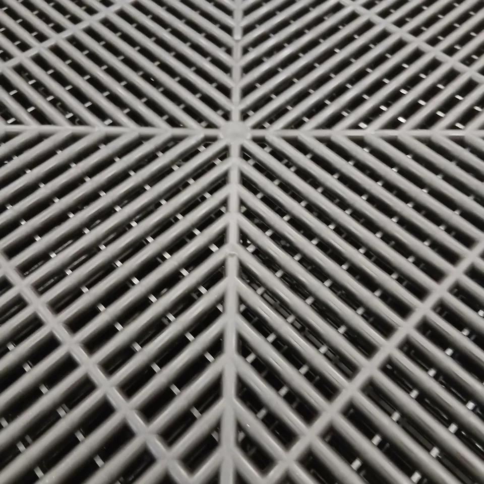 APPROXIMATELY 300 VENTED GARAGE FLOORING TILES