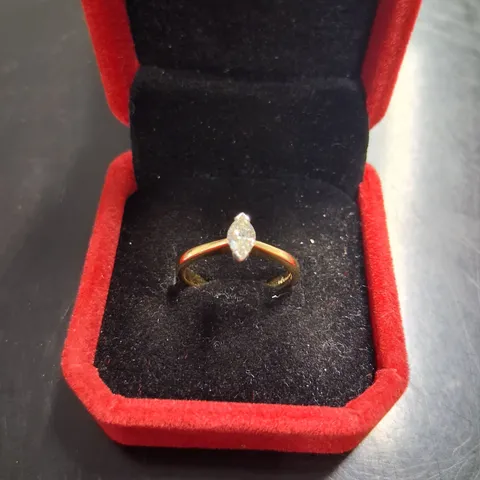 18CT GOLD SOLITAIRE RING SET WITH A NATURAL MARQUISE CUT DIAMOND