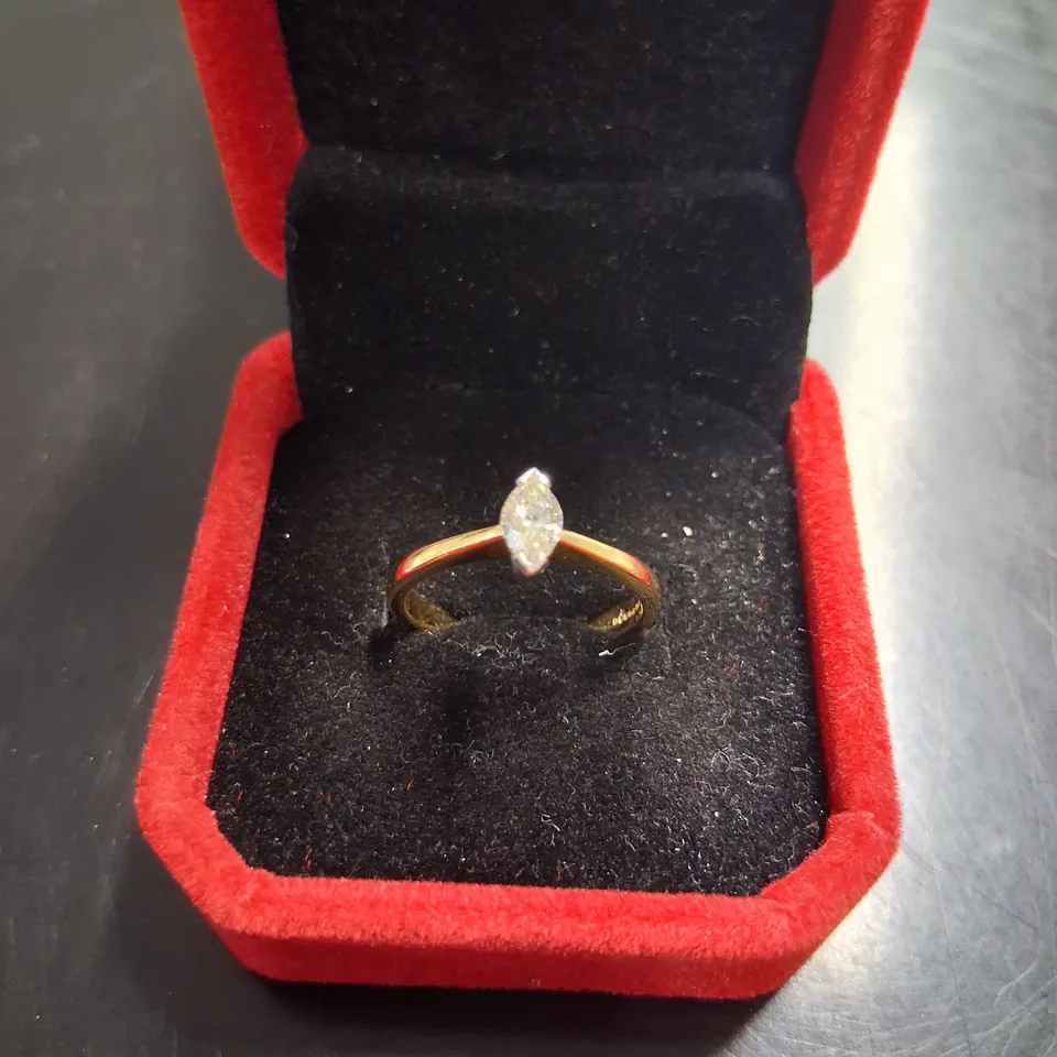 18CT GOLD SOLITAIRE RING SET WITH A NATURAL MARQUISE CUT DIAMOND