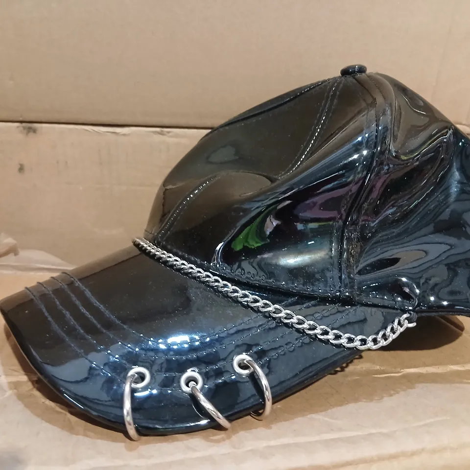 KOI MALEVOLENT BLACK PATENT PUNK CAP WITH CHAIN DETAIL