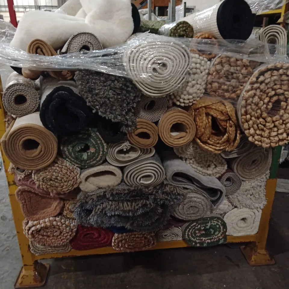 STILLAGE OF APPROXIMATELY 40 DESIGNER RUGS