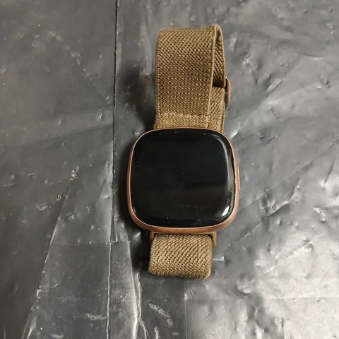 FITBIT SMARTWATCH WITH KHAKI FABRIC STRAP – ROSE GOLD CASE
