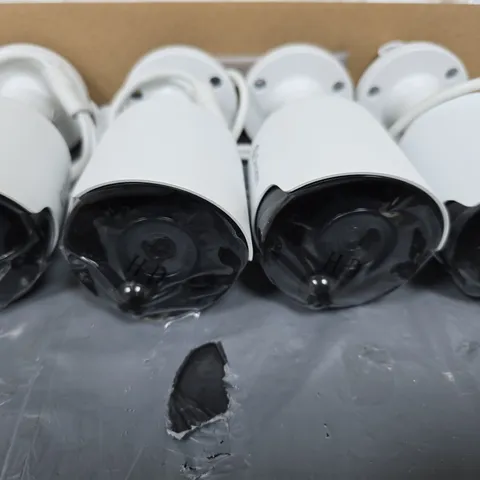 SWANN FOUR WHITE CCTV SECURITY CAMERAS WITH MOUNTING BASES AND CABLES