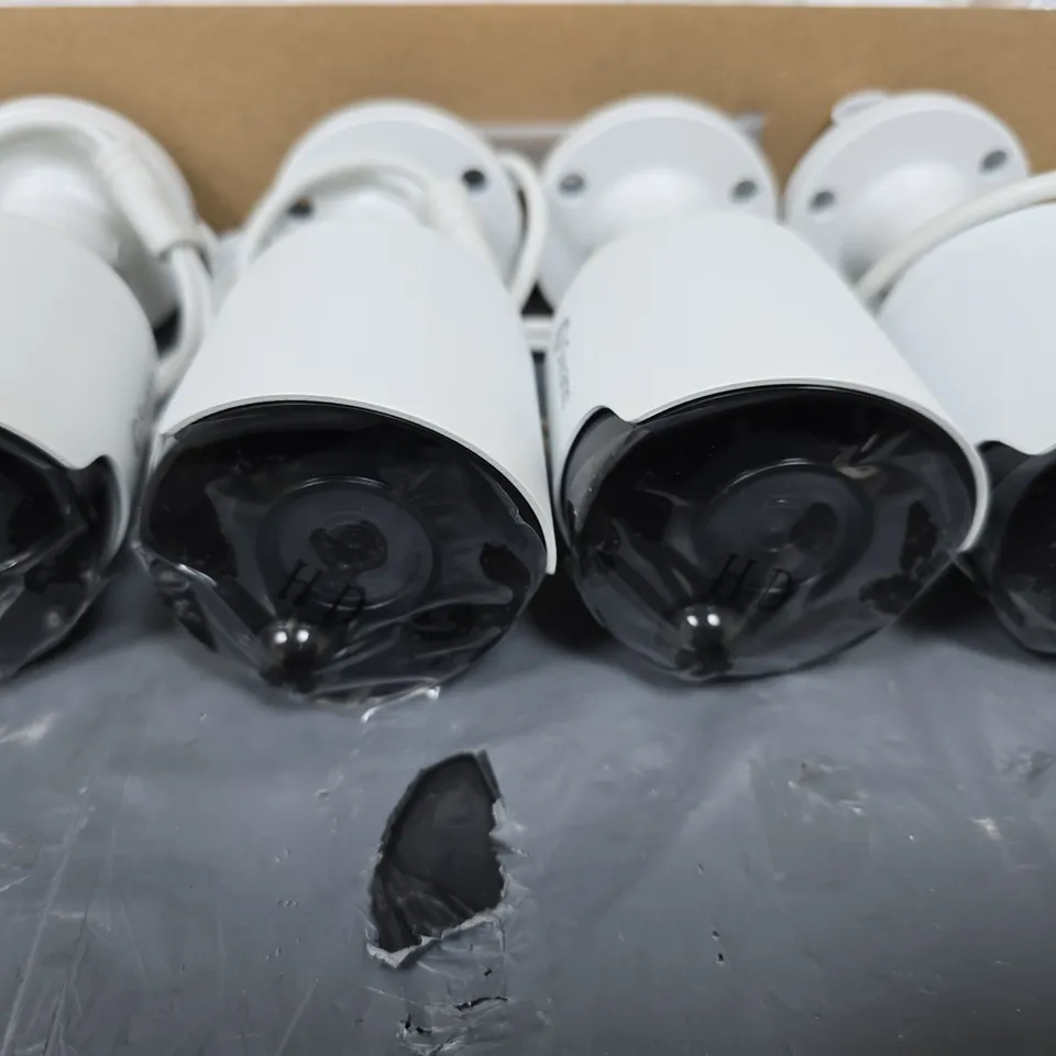 SWANN FOUR WHITE CCTV SECURITY CAMERAS WITH MOUNTING BASES AND CABLES