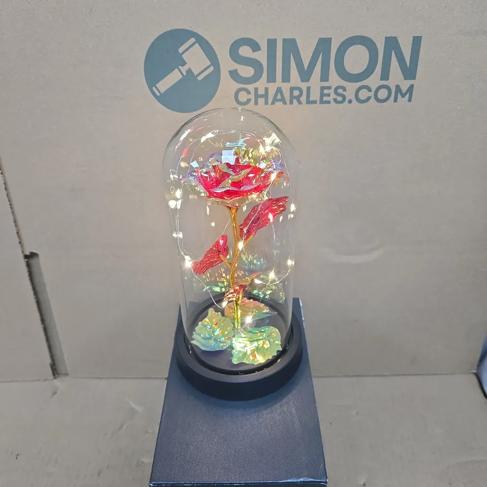 LED ILLUMINATED GLASS DOME ORNAMENT WITH IRIDESCENT ROSE ON DARK DISPLAY BASE