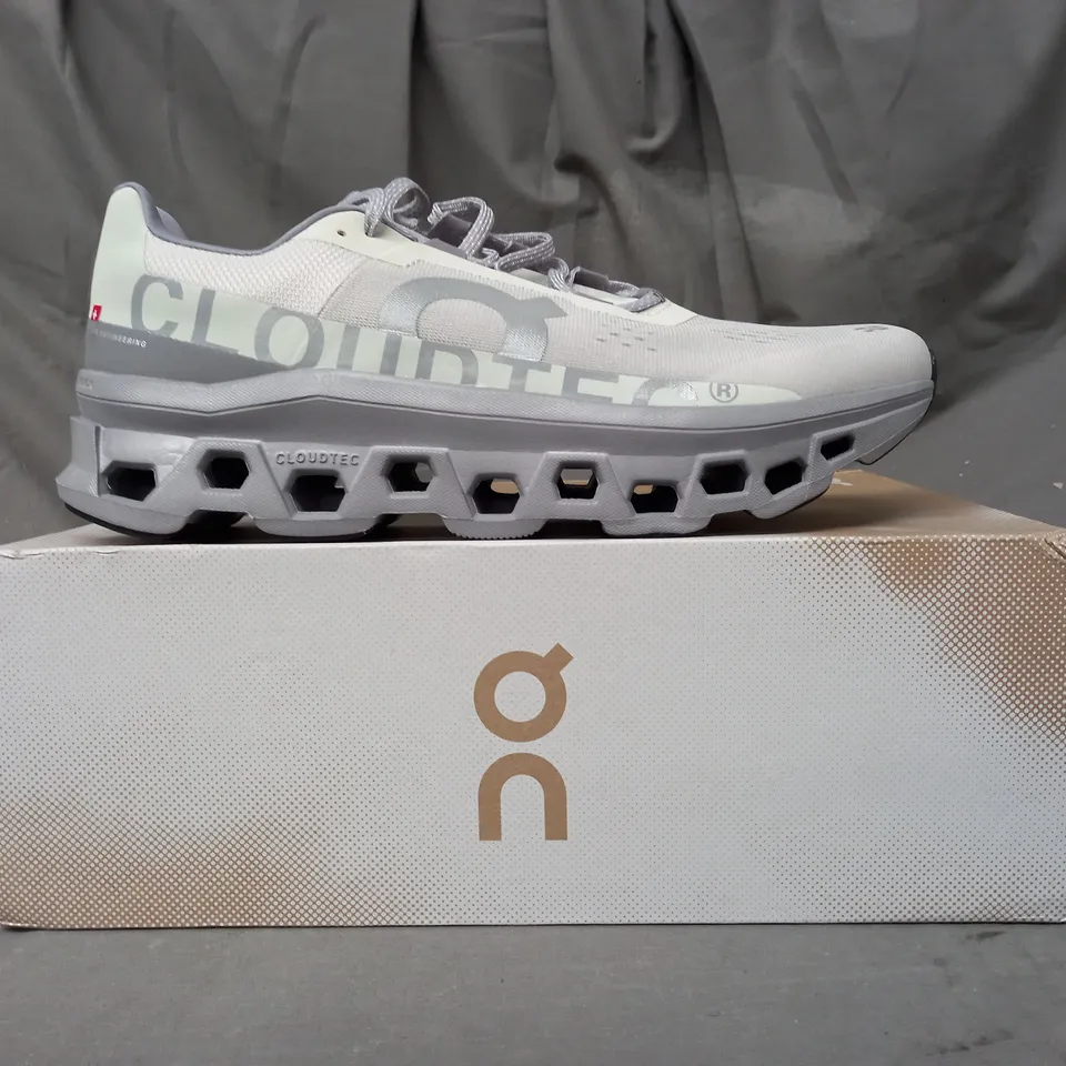 BOXED PAIR OF ON CLOUDMONSTER SHOES IN ICE/ALLOY UK SIZE 11