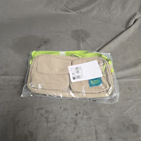 LULULEMON MULTI-POCKET CROSSBODY BAG IN SHEER OAK/SOUR GREEN ONE SIZE