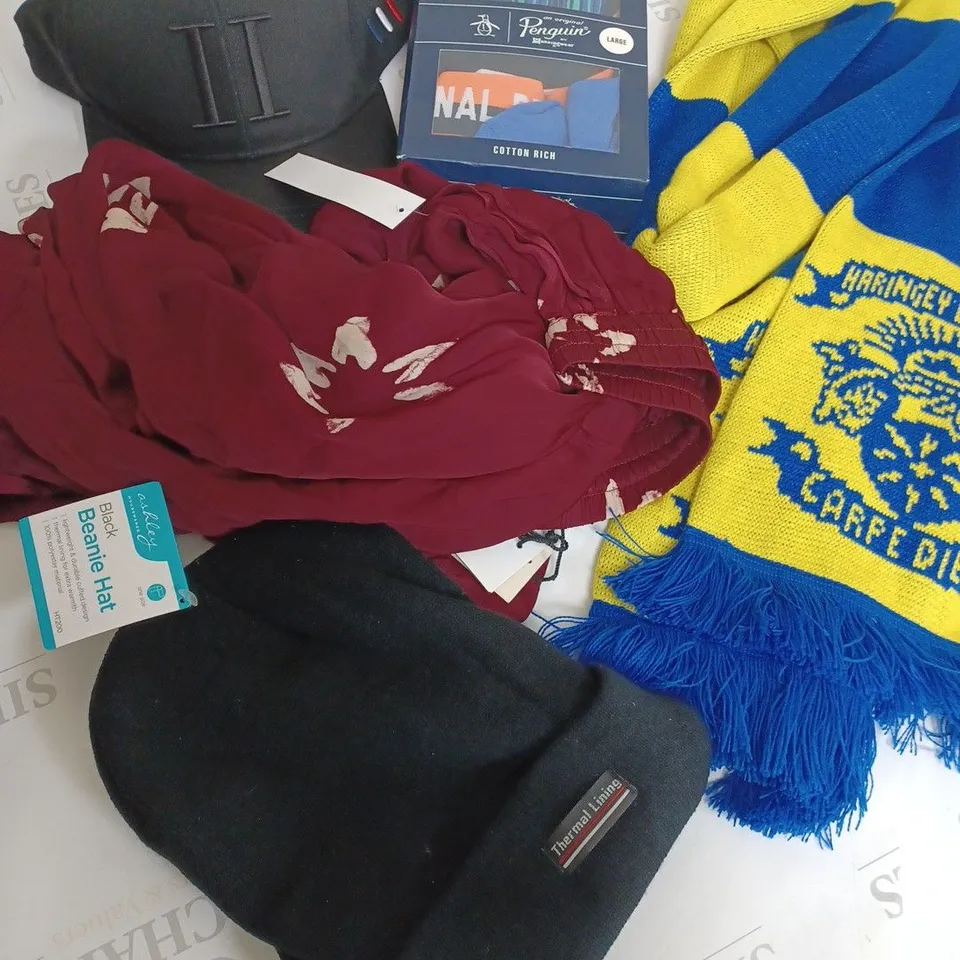 box of approximately 15 assorted clothing items to include penguin boxer set, east pants, carpe diem football scarf etc