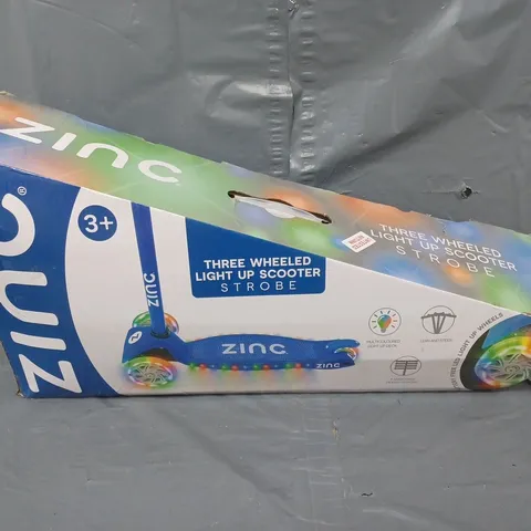 BOXED ZINC STROBE THREE WHEELED SCOOTER
