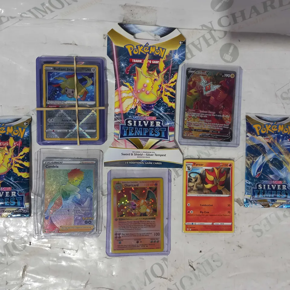 LOT OF ASSORTED POKÉMON TRADING CARDS AND BOOSTER PACKS