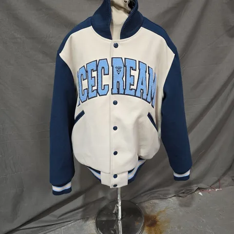 ICE CREAM BY BILLIONAIRE BOYS CLUB VARSITY JACKET – BLUE/CREAM, UK XL