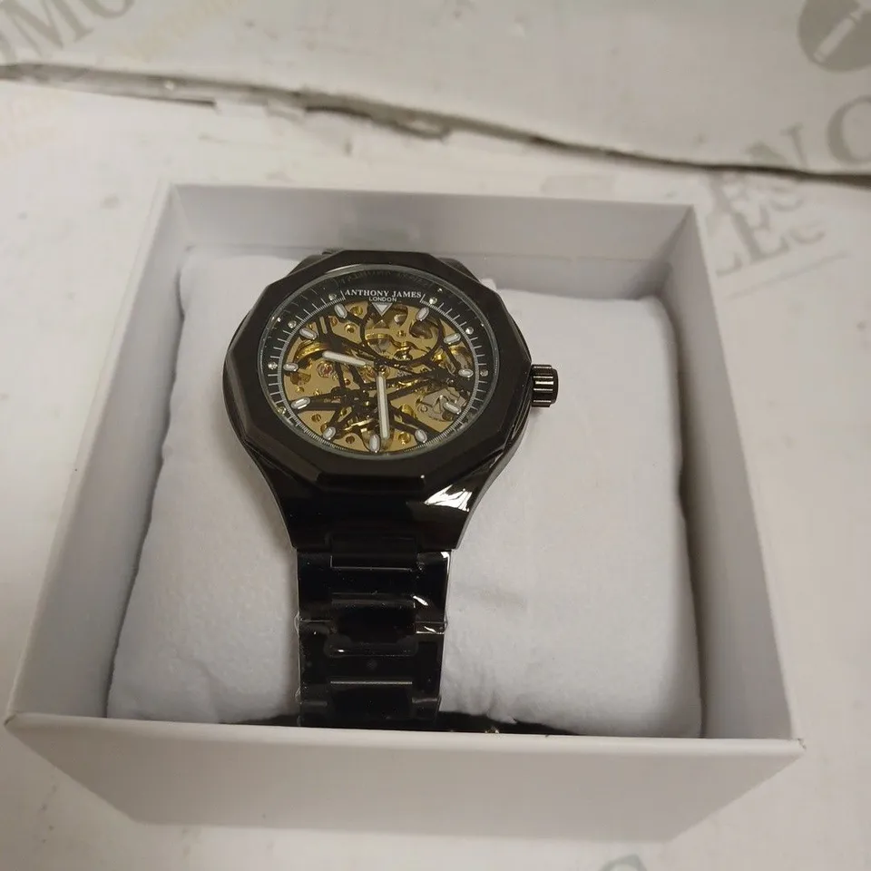 BOXED ANTHONY JAMES GENTS SPORTS SKELETON WATCH WITH STAINLESS STEEL BRACELET. 