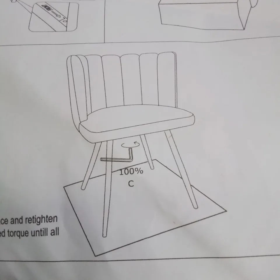 A BOXED GREEN VELVET CURVED BACK CHAIR