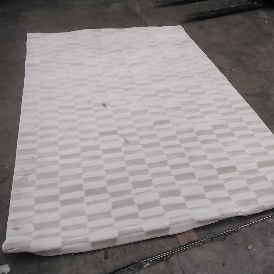 STILLAGE OF APPROXIMATELY 25 DESIGNER RUGS