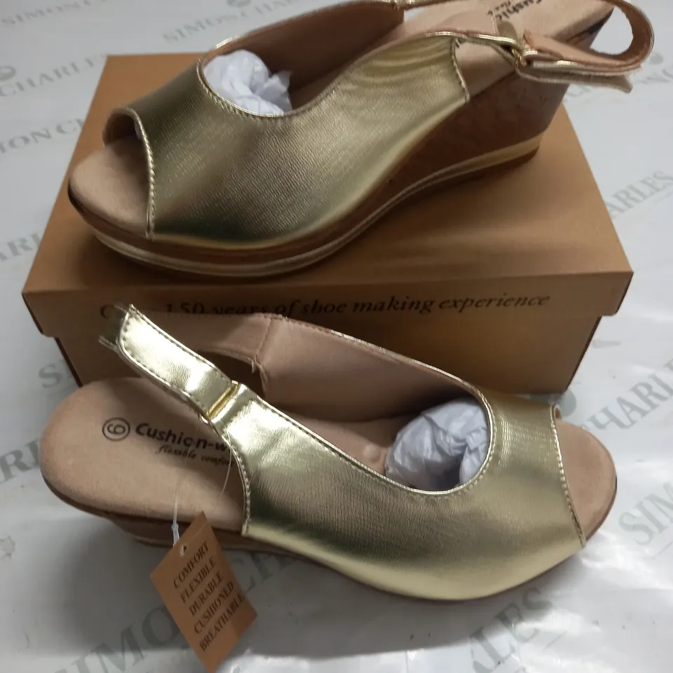 BOXED PAIR OF CUSHION WALK WEDGE SHOES IN GOLD - SIZE 6