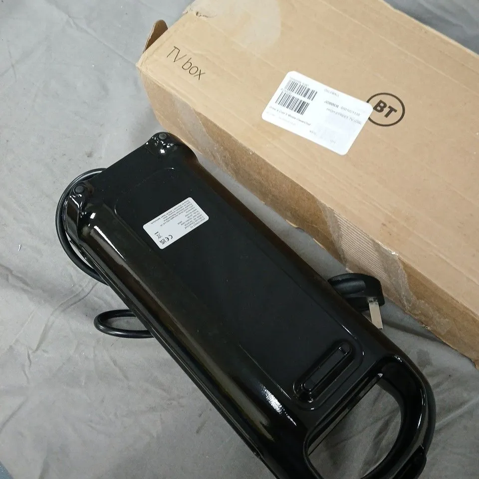 DREW & COLE ELECTRIC APPLIANCE – BLACK HANDHELD UNIT WITH DUAL OVAL HEATING SURFACES .