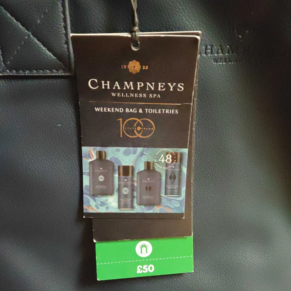 CHAMPNEYS WEEKEND BAG AND TOILETRIES INCLUDES DEODERANT AND BODY WASHES