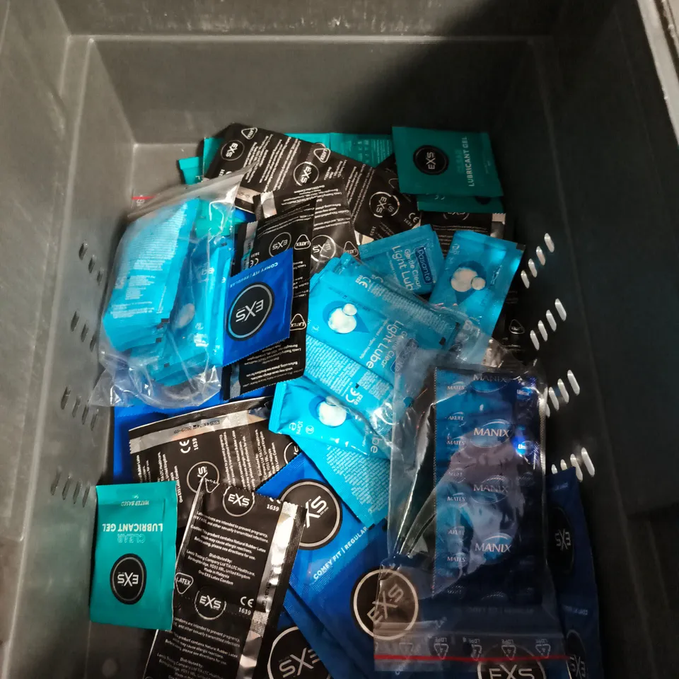 APPROXIMATELY 20 PACKS OF ASSORTED CONDOMS AND LUBE SACHETS